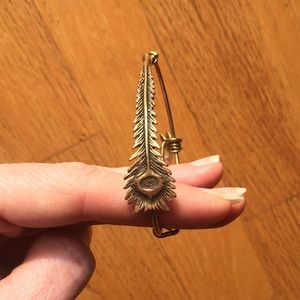 Alex and Ani vintage gold peacock bracelet.